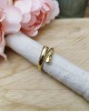 Bague entrelacée en acier doré