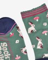 Chaussettes vertes avec des petits lapins blancs
