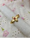 Bague dorée en forme d'aigle avec une pierre orange