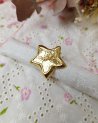 Grosse bague en forme d'étoile dorée