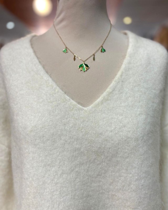 Pull écru avec des détails en dentelle blanche