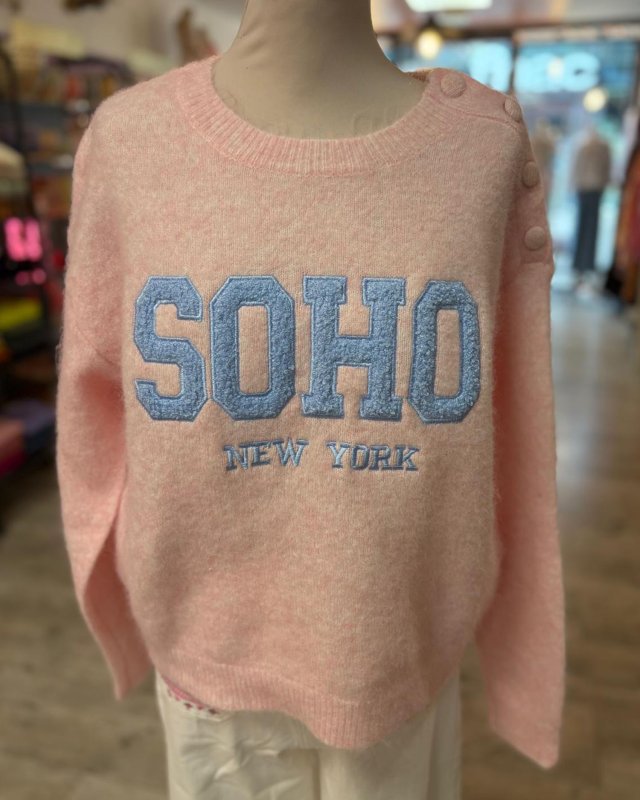 Pull rose à inscription...