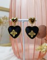 Boucles d'oreilles coeurs en velours noir et acier doré