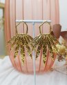 Grandes boucles d'oreilles à plumes dorées