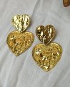 Boucles d'oreilles à deux coeurs en acier doré
