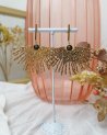 Boucles d'oreilles feuille de palmier doré avec une pierre