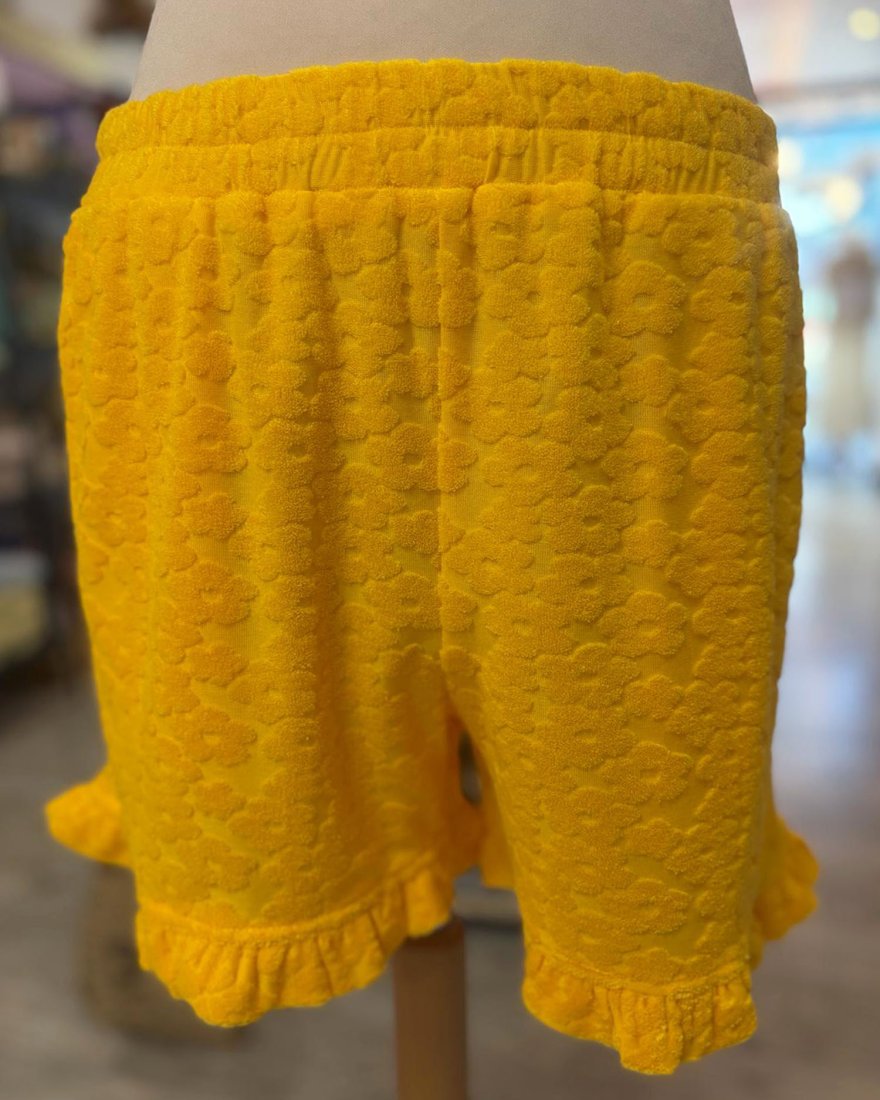 Short en éponge jaune à motif fleuri