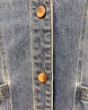 Veste sans manches en jean avec des petits volants