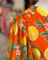 Longue robe orange à imprimé agrumes