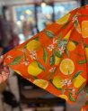Longue robe orange à imprimé agrumes